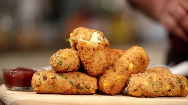 Crispy Cheese-Stuffed Potato Croquettes Crispy Cheese-Stuffed Potato Croquettes